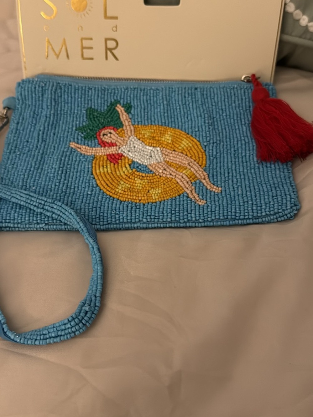 Viral bag. Hand-Beaded Blue Wristlet Clutch with Red Tassel